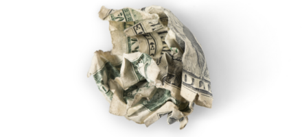 crumpled up dollar bill against white background